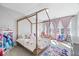 Bright bedroom with a four-poster bed, princess decor and plenty of natural light at 4544 W Rising Sun Dr, New Palestine, IN 46163