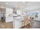 Modern kitchen with stainless steel appliances and a large island with pendant lighting at 4544 W Rising Sun Dr, New Palestine, IN 46163