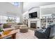 Bright living room with fireplace and custom built-in bookshelves at 4544 W Rising Sun Dr, New Palestine, IN 46163