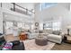 Open-concept living room with hardwood floors and large windows at 4544 W Rising Sun Dr, New Palestine, IN 46163
