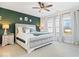 Serene main bedroom with accent wall, soft carpet and bright windows at 4544 W Rising Sun Dr, New Palestine, IN 46163