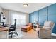 Comfortable home office with wood accent wall and natural light at 4544 W Rising Sun Dr, New Palestine, IN 46163