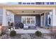 Covered patio offers an outdoor living space perfect for relaxation and entertaining with stylish furniture at 4544 W Rising Sun Dr, New Palestine, IN 46163