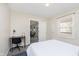 Bright bedroom showcasing a desk and view into another room, filled with natural light at 4629 Indianola Ave, Indianapolis, IN 46205