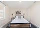 Comfortable bedroom features stylish decor and a well-lit, inviting atmosphere at 4629 Indianola Ave, Indianapolis, IN 46205