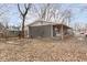 Cozy home with a covered porch featuring a hanging swing, plus mature trees and a spacious yard at 4629 Indianola Ave, Indianapolis, IN 46205