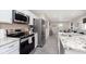 Modern kitchen showcasing stainless steel appliances, granite countertops, and an open layout to the living area at 4629 Indianola Ave, Indianapolis, IN 46205