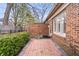 Charming brick patio and well-maintained yard creating a serene and private outdoor space for relaxation at 504 Bent Tree Ln, Indianapolis, IN 46260