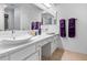 Bathroom with large mirrors, double vanity, and skylight, perfect for natural light and relaxation at 504 Bent Tree Ln, Indianapolis, IN 46260
