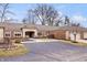 Charming brick home with an attached two-car garage and a paved driveway at 504 Bent Tree Ln, Indianapolis, IN 46260