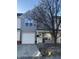 Charming townhome featuring a one-car garage, covered porch, and well-manicured landscaping at 504 Elkhart Dr, Westfield, IN 46074