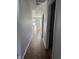 Hallway features light gray walls with white trim and durable laminate flooring throughout the home at 504 Elkhart Dr, Westfield, IN 46074