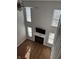 Living room features tall windows and a fireplace with mounted TV, perfect for entertaining or relaxing at 504 Elkhart Dr, Westfield, IN 46074