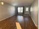 Bright living room featuring neutral walls, laminate flooring, and a window allowing plenty of natural light at 504 Elkhart Dr, Westfield, IN 46074