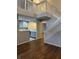 Spacious living room open to the kitchen with hard surface floors and staircase leading to the second floor at 504 Elkhart Dr, Westfield, IN 46074