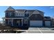 Charming two-story home showcasing a brick and siding facade with a spacious two car garage at 505 Tess Blvd, Westfield, IN 46074