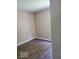 An unfurnished bedroom with vinyl floors and neutral paint at 5822 Blackley Ln, Indianapolis, IN 46254