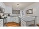 Well-lit kitchen with stainless steel appliances, granite countertops, and a view of the dining area at 5839 Beacon Cove Way, Indianapolis, IN 46237