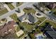 Aerial view of the property with a well-manicured lawn and mature trees at 6520 Forrest Commons Blvd, Indianapolis, IN 46227