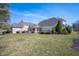 Expansive backyard with lush greenery and a well-maintained lawn at 6520 Forrest Commons Blvd, Indianapolis, IN 46227