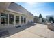 Spacious back patio area with brick accents and lounge chairs for relaxing at 6520 Forrest Commons Blvd, Indianapolis, IN 46227