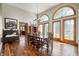 Dining room filled with natural light has hardwood floors, chandelier, and unique decorative accents at 6520 Forrest Commons Blvd, Indianapolis, IN 46227