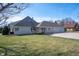 Well-maintained home with a manicured lawn and a charming front facade at 6520 Forrest Commons Blvd, Indianapolis, IN 46227