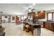 Open kitchen layout with an island, stainless steel appliances, and access to the dining area at 6520 Forrest Commons Blvd, Indianapolis, IN 46227