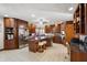 Spacious kitchen features a center island with seating, stainless steel appliances and ample counter space at 6520 Forrest Commons Blvd, Indianapolis, IN 46227