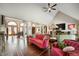 Open concept living room with fireplace, tile floors, plenty of seating, and stately columns at 6520 Forrest Commons Blvd, Indianapolis, IN 46227