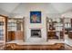 Living room features a fireplace with decorative mantle and built-in bar storage on either side at 6520 Forrest Commons Blvd, Indianapolis, IN 46227