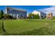 Backyard with putting green, playset and mature trees creating a fun outdoor space at 664 Hythe Way, Westfield, IN 46074