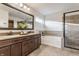 A gorgeous bathroom with a double vanity, soaking tub and a tiled glass shower at 664 Hythe Way, Westfield, IN 46074