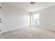 Light-filled bedroom featuring large window and neutral carpet at 664 Hythe Way, Westfield, IN 46074