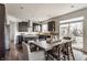 Modern kitchen with stainless steel appliances, granite countertops, a kitchen island, and an adjacent dining area at 664 Hythe Way, Westfield, IN 46074