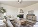 Bright living room boasts a fireplace, stylish furniture, and neutral tones, creating a cozy atmosphere at 664 Hythe Way, Westfield, IN 46074
