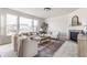 Spacious living room featuring a fireplace, neutral decor, and oversized windows at 664 Hythe Way, Westfield, IN 46074