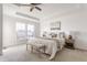 Serene main bedroom offers a tray ceiling, plush carpet, and ample natural light creating a relaxing retreat at 664 Hythe Way, Westfield, IN 46074
