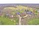 Expansive property showcasing the estate's layout with mature trees and greenery at 6778 Old Hunt Club Rd, Zionsville, IN 46077