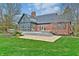 Spacious backyard with well-maintained lawn, back patio, mature trees and professional landscaping at 6778 Old Hunt Club Rd, Zionsville, IN 46077