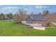 Beautiful backyard with pool, patio, and lush green lawn at 6778 Old Hunt Club Rd, Zionsville, IN 46077