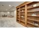 Basement area features large built-in shelving at 6778 Old Hunt Club Rd, Zionsville, IN 46077