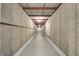 Unfinished basement area with concrete walls and floors, exposed pipes and metal ceiling, offering storage space at 6778 Old Hunt Club Rd, Zionsville, IN 46077