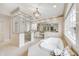 Luxurious bathroom with standalone tub, glass-enclosed shower, and stylish vanity, creating a spa-like retreat at 6778 Old Hunt Club Rd, Zionsville, IN 46077