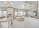Bright bathroom featuring a soaking tub under a large window and a glass enclosed shower at 6778 Old Hunt Club Rd, Zionsville, IN 46077