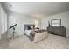 Comfortable bedroom with neutral tones, plush carpet, dresser and unique telescope near a window at 6778 Old Hunt Club Rd, Zionsville, IN 46077