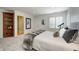 Bedroom featuring soft carpet, a comfortable bed, an elegant bookshelf, and a telescope by the window at 6778 Old Hunt Club Rd, Zionsville, IN 46077