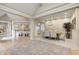 Dining area features hardwood floors, a modern light fixture, and seating for six at 6778 Old Hunt Club Rd, Zionsville, IN 46077