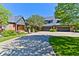 Beautiful brick home featuring a spacious driveway and multiple garage spaces at 6778 Old Hunt Club Rd, Zionsville, IN 46077