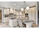 Bright eat-in kitchen featuring a granite island, stainless steel appliances, and custom cabinets at 6778 Old Hunt Club Rd, Zionsville, IN 46077